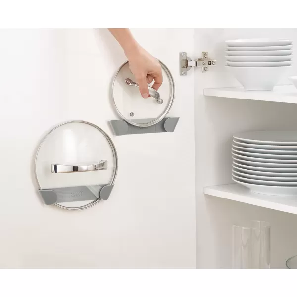 imageJoseph Joseph Duo  Set of 3 Pot and Pan Lid Holders Self Adhesive Wall Mount Storage Organiser Suitable for Lids Up to 24 cm 3M VHB Tape Included Grey