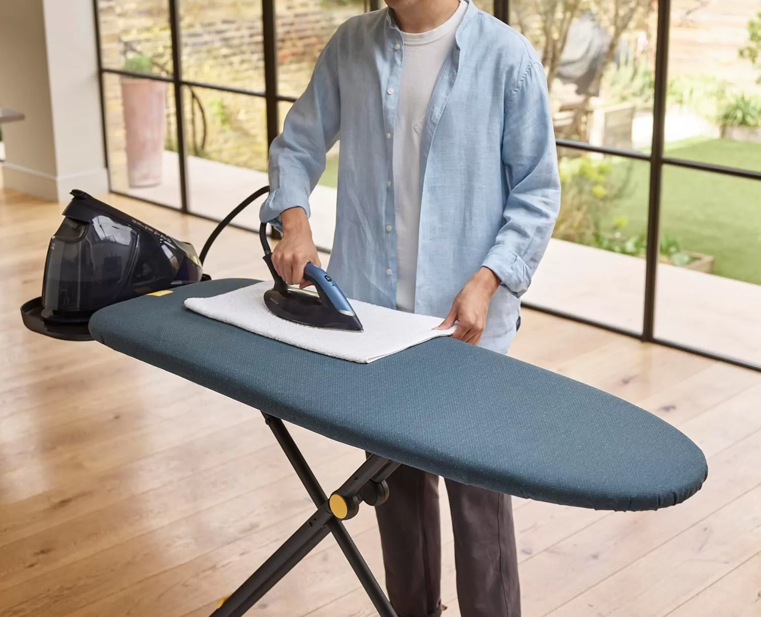imageJoseph Joseph Glide Plus Large Ironing Board 135 x 45cm with Compact Adjustable Legs and Integrated Heat Resistant Steam Iron Rest Antidrip Super Absorbent Cotton Cover BlackBlue