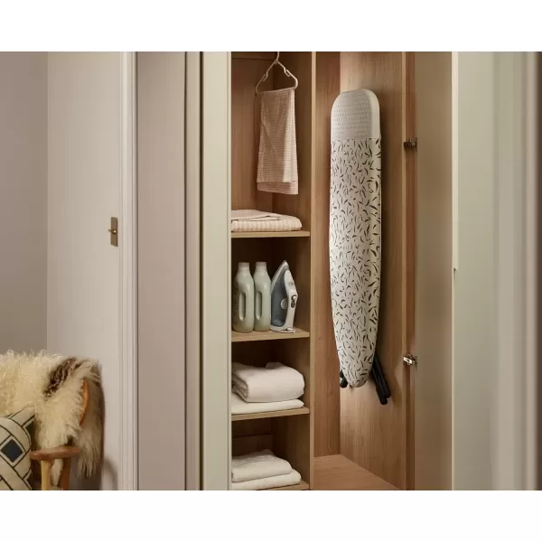 imageJoseph Joseph Glide Plus Ironing Board 130 x 38cm with Compact Adjustable Legs and Integrated Heat Resistant Steam Iron Rest Printed Antidrip Super Absorbent Cotton Cover Ecru Scatter