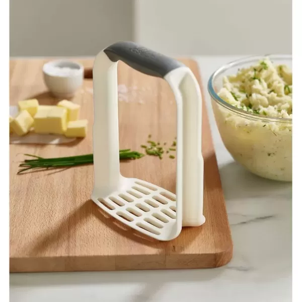 imageJoseph Joseph EasyMash Plastic Potato Masher Ergonomic with NonSlip Grip and PanScraping Edges Dishwasher Safe Onesize White