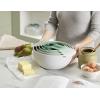 imageJoseph Joseph Nest 9 Plus 9 Piece Compact Food Preparation Set with Mixing Bowls Measuring cups Sieve and Colander Editions Range Sage GreenGreen