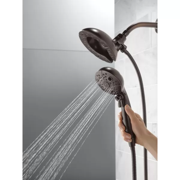 imageDelta Faucet 5Spray In2ition Dual Shower Head with Handheld Spray H2Okinetic Oil Rubbed Bronze Shower Head with Hose Handheld Shower Heads Venetian Bronze 58480RBPK 175 GPM Water FlowVenetian Bronze