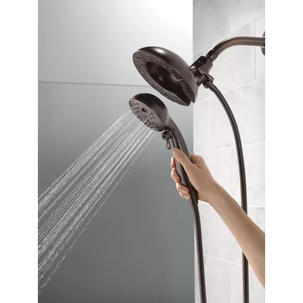 imageDelta Faucet 5Spray In2ition Dual Shower Head with Handheld Spray H2Okinetic Oil Rubbed Bronze Shower Head with Hose Handheld Shower Heads Venetian Bronze 58480RBPK 175 GPM Water FlowVenetian Bronze
