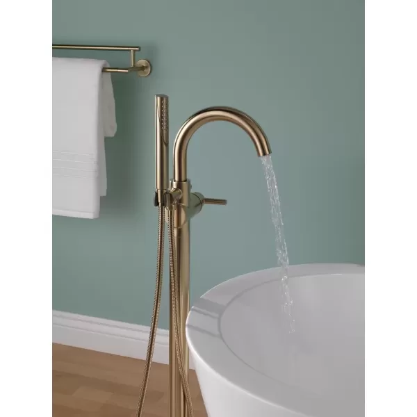 imageDelta Faucet Trinsic FloorMount Freestanding Tub Filler with Hand Held Shower Chrome Bathtub Faucet Tub Faucet Chrome T4759FL Valve Not IncludedChampagne Bronze