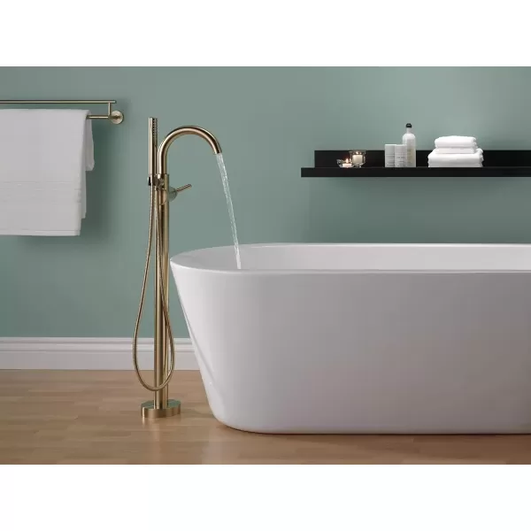 imageDelta Faucet Trinsic FloorMount Freestanding Tub Filler with Hand Held Shower Chrome Bathtub Faucet Tub Faucet Chrome T4759FL Valve Not IncludedChampagne Bronze