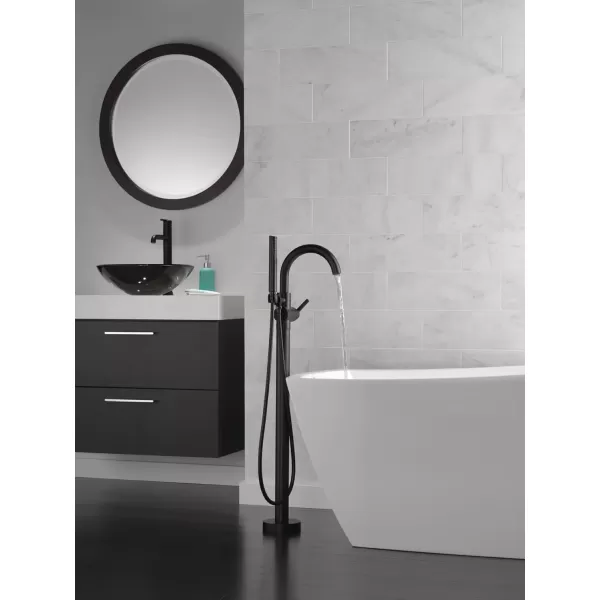 imageDelta Faucet Trinsic FloorMount Freestanding Tub Filler with Hand Held Shower Chrome Bathtub Faucet Tub Faucet Chrome T4759FL Valve Not IncludedMatte Black