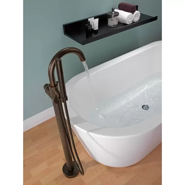 imageDelta Faucet Trinsic FloorMount Freestanding Tub Filler with Hand Held Shower Chrome Bathtub Faucet Tub Faucet Chrome T4759FL Valve Not IncludedVenetian Bronze