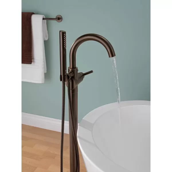 imageDelta Faucet Trinsic FloorMount Freestanding Tub Filler with Hand Held Shower Chrome Bathtub Faucet Tub Faucet Chrome T4759FL Valve Not IncludedVenetian Bronze