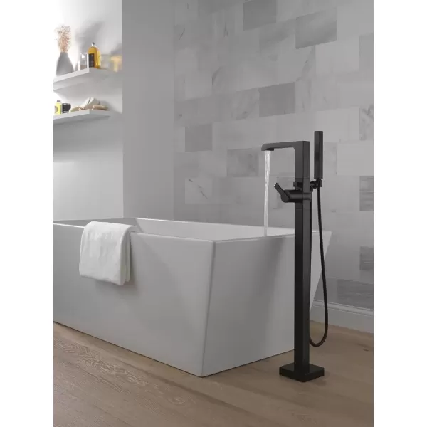 imageDelta Faucet Ara FloorMount Freestanding Tub Filler with Hand Held Shower Black Bathtub Faucet Tub Faucet Matte Black T4767BLFL Valve Not IncludedMatte Black