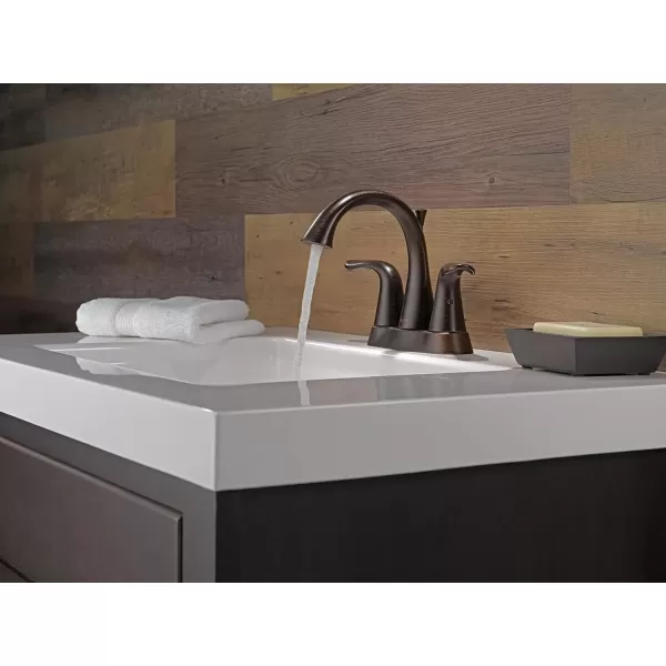 imageDelta Faucet Lahara Gold Bathroom Faucet Centerset Bathroom Faucet Diamond Seal Technology Metal Drain Assembly Champagne Bronze 2538CZMPUDSTVenetian Bronze