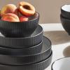 imageChristian Siriano Larosso 12Piece Stoneware Dinnerware Set with Dinner Bowls and Pasta Bowls Plates and Bowls Set Dish Set for 4 Dark BlueBlackWhite