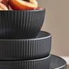 imageChristian Siriano Larosso 12Piece Stoneware Dinnerware Set with Dinner Bowls and Pasta Bowls Plates and Bowls Set Dish Set for 4 Dark BlueBlackWhite