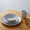 imageStone lain Romy Stoneware 16piece Round Dinnerware Set Spotted WhiteBlack 16Piece Service for 4Spotted WhiteBlack