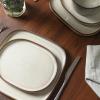 imageStone Lain Cairo 12Piece Dinnerware Set Stoneware Plates and Bowls Set Microwave and Dishwasher Safe Includes Dinner and Salad Plates Cereal Bowls Dishes for 4 SandGray