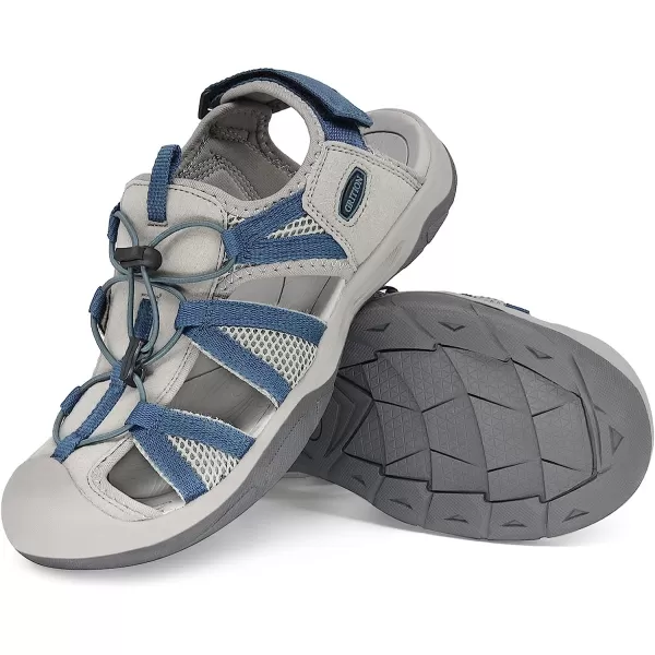 imageGRITION Womens Closed Toe Trekking Sandals Waterproof Hiking Sandals Comfort Breathable Outdoor Summer Flat Adjustable WearResistant Sports Sandals on BeachBlue