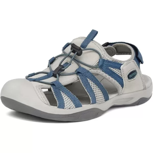 imageGRITION Womens Closed Toe Trekking Sandals Waterproof Hiking Sandals Comfort Breathable Outdoor Summer Flat Adjustable WearResistant Sports Sandals on BeachBlue